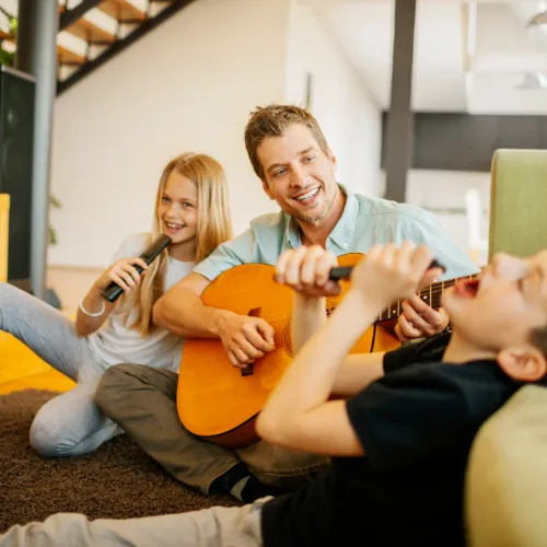 Family enjoying a music therapy session together.