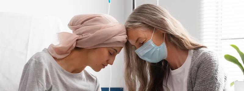 Person offering emotional support to a loved one with breast cancer.