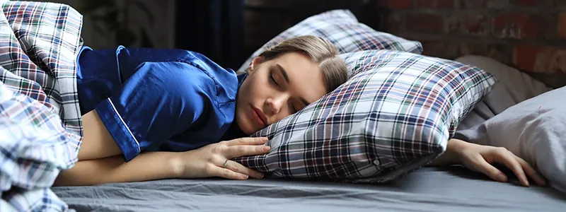 Person enjoying restful sleep, essential for a strong immune system