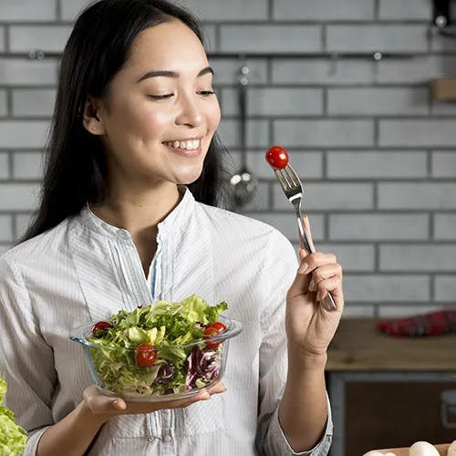 Woman Enjoying Mindful Eating with Salad
