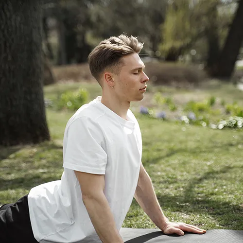 Relaxed man practicing breathing exercises