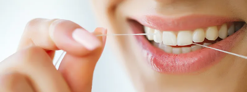Daily flossing prevents cavities and gum disease